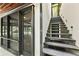 Exterior view featuring an eye-catching staircase and screened porch with dark trim at 2105 Fairhaven Ne Cir, Atlanta, GA 30305