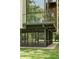 Outdoor living space with a screened in seating area beneath a stylish balcony at 2105 Fairhaven Ne Cir, Atlanta, GA 30305