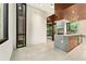 Spacious kitchen with gray tile flooring, wood paneled ceilings, and granite kitchen island at 2105 Fairhaven Ne Cir, Atlanta, GA 30305