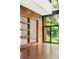 Open concept living space features wooden walls and large windows with wooded views at 2105 Fairhaven Ne Cir, Atlanta, GA 30305