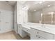 Bathroom featuring dual vanities, tile floor, walk-in shower and double-door closet at 2345 Gallard St, Lawrenceville, GA 30043