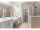 Bathroom features dual vanities, glass shower and doorway leading into the water closet at 2345 Gallard St, Lawrenceville, GA 30043
