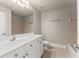 Bright bathroom with white cabinets, large mirror, and combination shower and tub at 2345 Gallard St, Lawrenceville, GA 30043