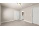 Carpeted bedroom featuring a closet, access to the bathroom, and neutral wall paint at 2345 Gallard St, Lawrenceville, GA 30043