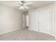 Bedroom featuring a ceiling fan, closet, and neutral wall paint with plush carpeting at 2345 Gallard St, Lawrenceville, GA 30043
