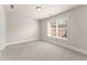 Neutral bedroom with plush carpeting, a large window, and ample natural light at 2345 Gallard St, Lawrenceville, GA 30043