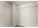 Walk-in closet with wire shelving, neutral walls, and carpeting at 2345 Gallard St, Lawrenceville, GA 30043