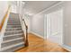 Light-filled entryway with hardwood floors, staircase, and view into other rooms at 2345 Gallard St, Lawrenceville, GA 30043