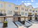 Townhomes featuring brick and siding, with driveways and balconies at 2345 Gallard St, Lawrenceville, GA 30043