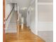 Inviting foyer with hardwood floors, staircase, and elegant trim, offering a warm welcome at 2345 Gallard St, Lawrenceville, GA 30043