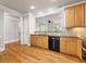 Traditional kitchen showcasing wood cabinets, granite counters, and black appliances at 2345 Gallard St, Lawrenceville, GA 30043