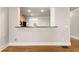 Open kitchen layout with bar seating and stainless steel appliances at 2345 Gallard St, Lawrenceville, GA 30043