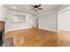 Spacious living room featuring hardwood flooring, fireplace, and natural light at 2345 Gallard St, Lawrenceville, GA 30043