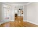Open concept space featuring hardwood floors and access to balcony and living room at 2345 Gallard St, Lawrenceville, GA 30043