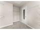 Carpeted walk-in closet featuring white wire shelving and a door with window paneling at 2345 Gallard St, Lawrenceville, GA 30043