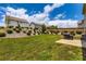 Scenic backyard featuring a manicured lawn, patio, and grill at 2486 Bear Mountain St, Lithonia, GA 30058