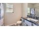Cozy bathroom featuring granite counters, a toilet, sink, and decorative shower curtain at 2486 Bear Mountain St, Lithonia, GA 30058