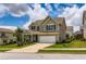 Charming two-story home with landscaped front yard and attached two-car garage in a suburban neighborhood at 2486 Bear Mountain St, Lithonia, GA 30058