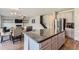 Spacious kitchen island with granite countertop perfect for dining and entertaining, connecting living spaces at 2486 Bear Mountain St, Lithonia, GA 30058