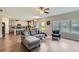 Open concept living room flows into the kitchen and features a comfortable sectional sofa at 2486 Bear Mountain St, Lithonia, GA 30058