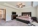 Relaxing main bedroom with tray ceiling and a comfortable bed at 2486 Bear Mountain St, Lithonia, GA 30058