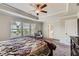 Spacious main bedroom with natural lighting, ceiling fan, and adjoining bathroom at 2486 Bear Mountain St, Lithonia, GA 30058