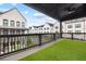 Overhead view of a balcony with artificial turf and black iron railings at 6710 Pippin Walk, Alpharetta, GA 30005