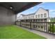Wide balcony with artificial turf offering beautiful views of townhome community at 6710 Pippin Walk, Alpharetta, GA 30005