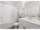 Bathroom with a white vanity, subway tile shower, and patterned shower curtain at 6710 Pippin Walk, Alpharetta, GA 30005