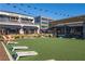 Outdoor turf space with games, dining and outdoor activities by various businesses at 6710 Pippin Walk, Alpharetta, GA 30005