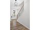 Foyer featuring wood-look floors, a staircase with black iron spindles and a view to the front door at 6710 Pippin Walk, Alpharetta, GA 30005