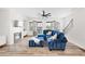 The living room boasts a fireplace, neutral decor, and an adjacent staircase to the upper level at 6710 Pippin Walk, Alpharetta, GA 30005