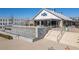 Scenic outdoor view of Ocean & Acre restaurant, featuring outdoor seating, stairs, landscaping and modern architecture at 6710 Pippin Walk, Alpharetta, GA 30005