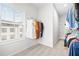 Walk-in closet features ample storage and natural light from a window at 6710 Pippin Walk, Alpharetta, GA 30005