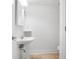 Cozy bathroom with tiled floors and a pedestal sink, perfect for guests at 149 Rondak Se Cir, Smyrna, GA 30080