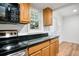 Well-equipped kitchen boasting modern microwave, black appliances, granite countertops, and ample cabinet space at 149 Rondak Se Cir, Smyrna, GA 30080