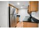 Modern kitchen with stainless steel fridge, granite counters, and hardwood floors at 149 Rondak Se Cir, Smyrna, GA 30080