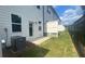 A view of the backyard highlighting its layout, green grass, and modern fencing at 1615 Gunnin Nw Trce, Atlanta, GA 30318