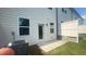 The backyard features a compact, grassy area with a privacy fence and an HVAC unit at 1615 Gunnin Nw Trce, Atlanta, GA 30318