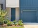 Charming townhome featuring a one-car garage and a beautifully landscaped front entrance at 1615 Gunnin Nw Trce, Atlanta, GA 30318