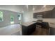 Modern kitchen featuring granite countertops, dark cabinetry, and stainless steel appliances at 1615 Gunnin Nw Trce, Atlanta, GA 30318