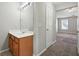 Bathroom vanity featuring a large mirror and a sink with updated fixtures at 5487 Walnut Lane Ln, Stonecrest, GA 30038