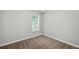 Cozy bedroom features neutral walls, carpet, and a bright window at 5487 Walnut Lane Ln, Stonecrest, GA 30038