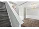 Entryway with carpet stairs, and white trim leading into a formal dining room at 5487 Walnut Lane Ln, Stonecrest, GA 30038