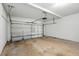Spacious two car garage with concrete flooring and white door at 5487 Walnut Lane Ln, Stonecrest, GA 30038