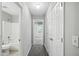 Hallway with carpeted floor shows bathroom and bedroom doors at 5487 Walnut Lane Ln, Stonecrest, GA 30038