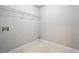 Photo of an empty laundry room with connections and wire shelving at 5487 Walnut Lane Ln, Stonecrest, GA 30038