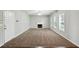 Spacious living room featuring neutral walls, fireplace, and plush carpeting at 5487 Walnut Lane Ln, Stonecrest, GA 30038