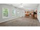 Sun-filled living area leading into a kitchen and dining space with views of the backyard at 5487 Walnut Lane Ln, Stonecrest, GA 30038