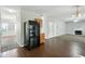 Open concept living area with hardwood floors, fireplace, and adjacent dining room at 5487 Walnut Lane Ln, Stonecrest, GA 30038